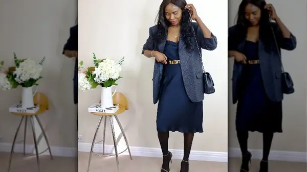 Woman in blue slip dress with blazer 