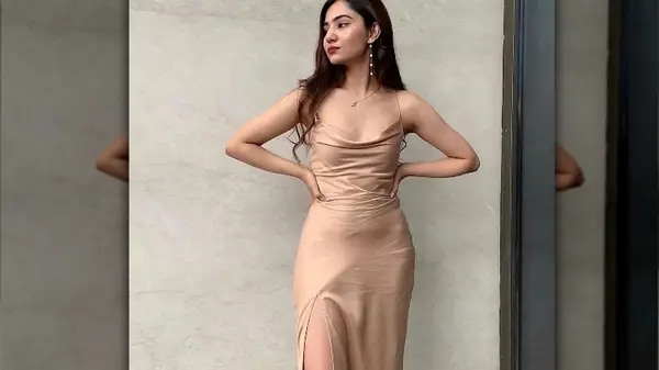 Woman in a nude-toned slip dress