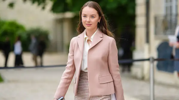 Woman in a pink blazer