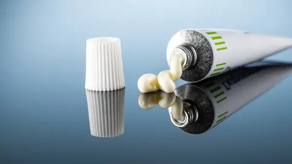 Tube of ointment on mirror surface