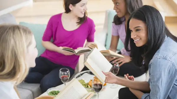 women laughing in book club