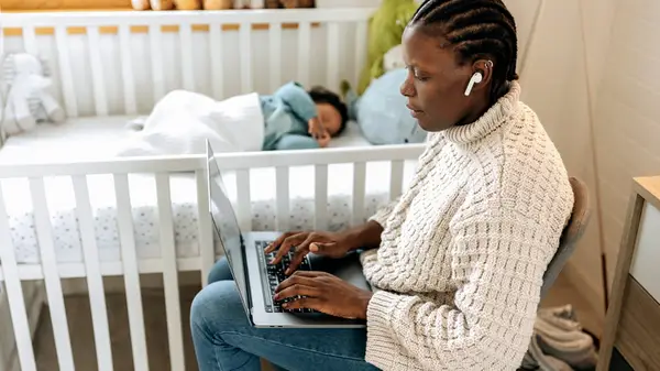 Person working next to baby