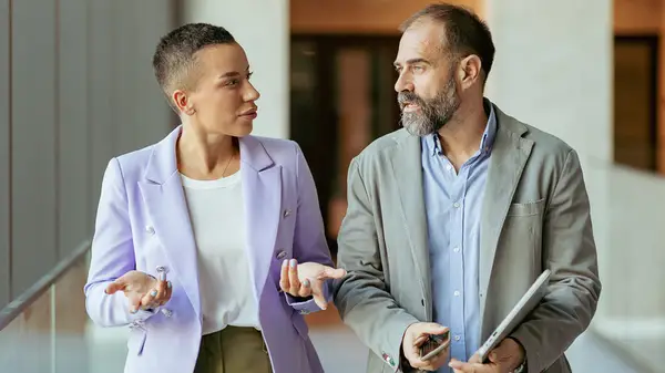 Two colleagues talking