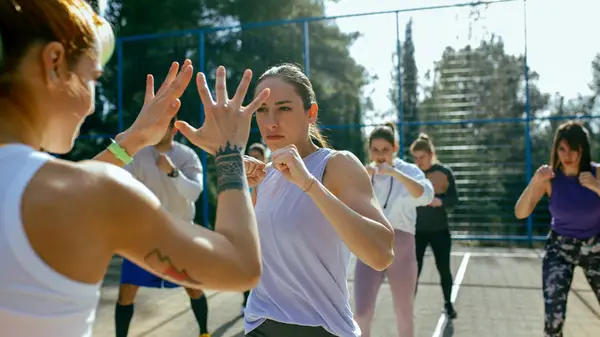 women taking a self defense class