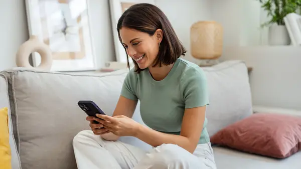 Woman typing on her phone