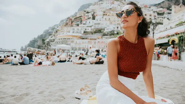 Woman sitting on a mediterranean beach