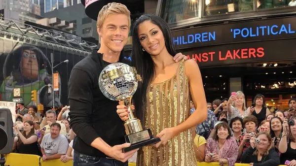 Derek Hough with Nicole Scherzinger and their Dancing with the Stars trophy