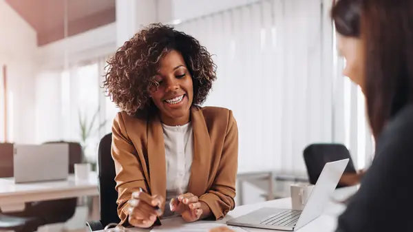woman in interview explaining numbers
