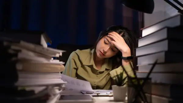 Woman working overtime in office