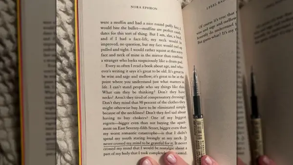 A hand holding open a book to make underlines