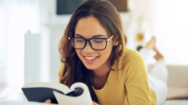 Woman reading a book and smiling