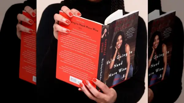 Hands holding a copy of 