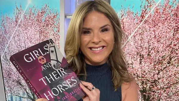 Jenna Bush Hager holding a copy of Girls and Their Horses