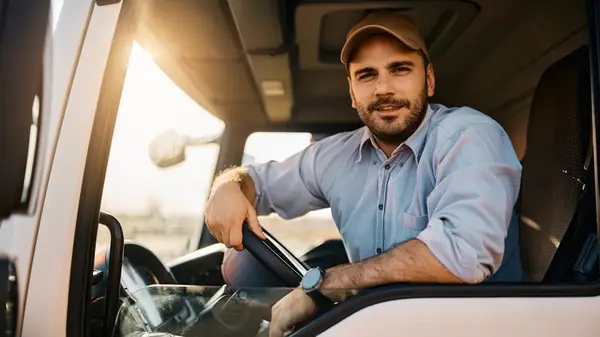 A truck driver posing