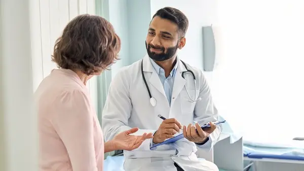 A doctor talking with patient