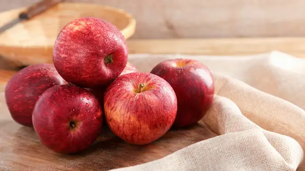Apples on a wooden board
