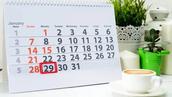 A calendar sitting on a desk