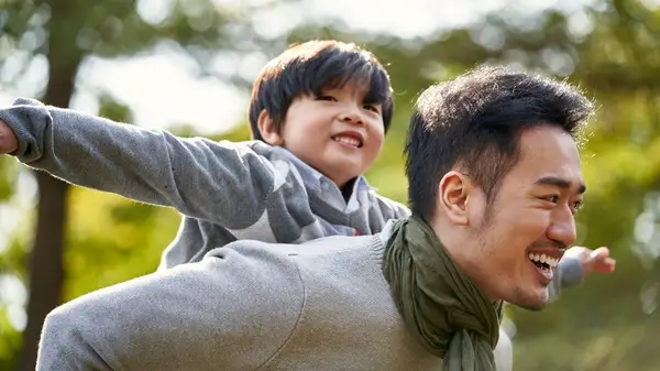 A father playing with his son