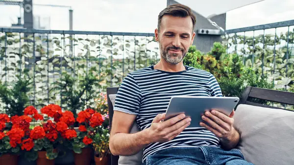 Man sitting on balcony