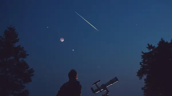 Sky with moon and shooting star