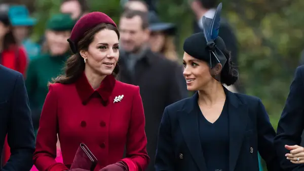 Kate Middleton and Meghan Markle walking outside