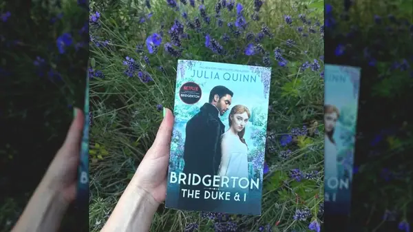 A hand holding a copy of 