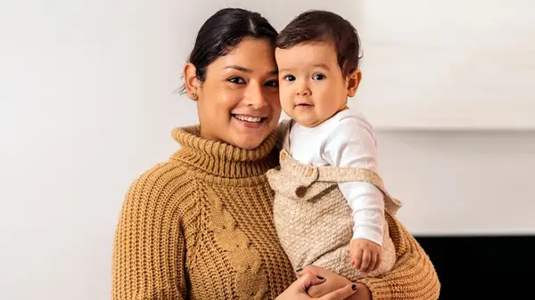 Woman posing with a baby