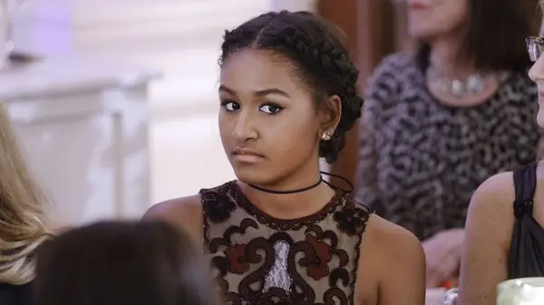 Sasha Obama sitting down