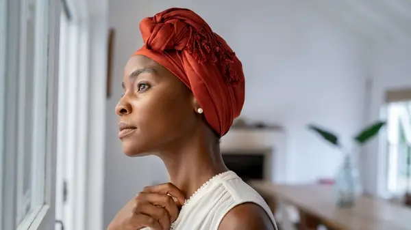 woman thinking by window