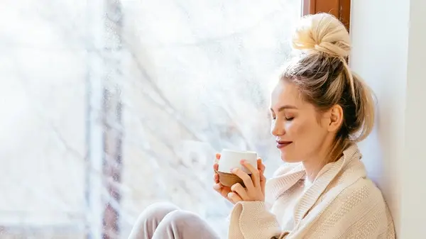 woman relaxing with tea