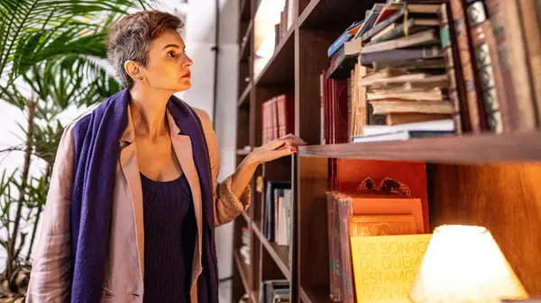 Woman looking at a bookshelf