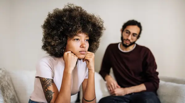 Woman turned away from a man