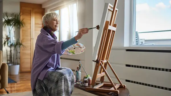 senior woman painting