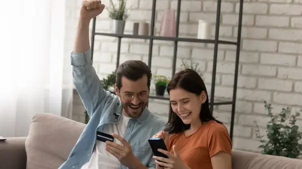 Couple paying with a credit card