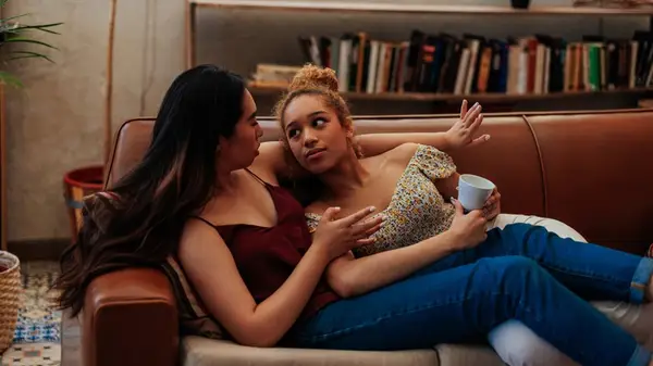 Couple putting money in a piggybank