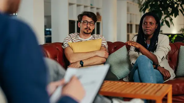 A couple speaking to a professional