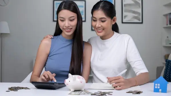 young couple saving money