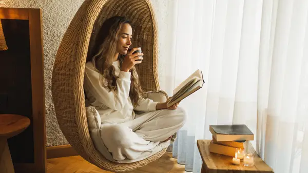 Woman reading in swinging chair
