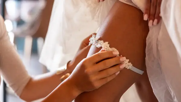 A bride with a garter on her leg