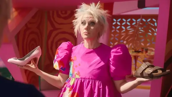 Weird Barbie holding shoes