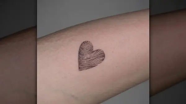Fingerprint heart tattoo