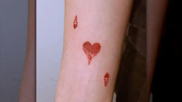 Heart card tattoo