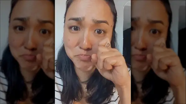 Tear drop finger tattoo