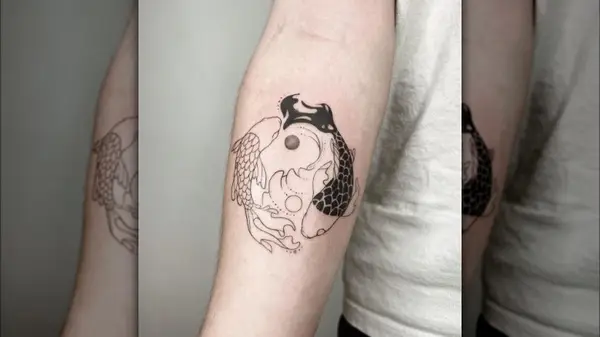 Pisces ying and yang tattoo