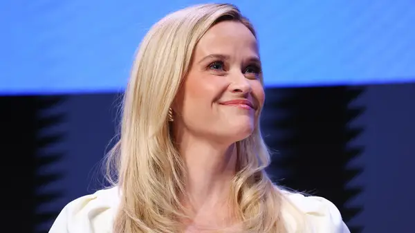 Reese Witherspoon smiling on stage