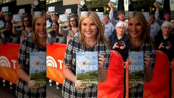 Jenna Bush Hager on Instagram in front of a crowd holding a book
