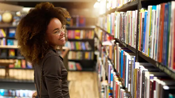 Woman at bookstore looking at books