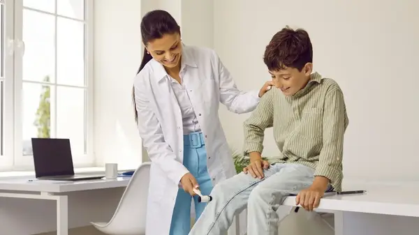 doctor testing reflexes