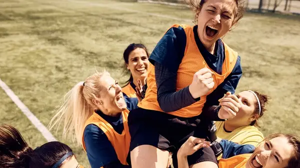 women athletes cheering