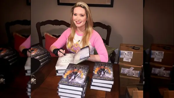 Sarah J. Maas with Empire of Storms books